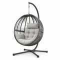 Sedia sospesa in rattan con cuscini in poliestere e struttura in metallo